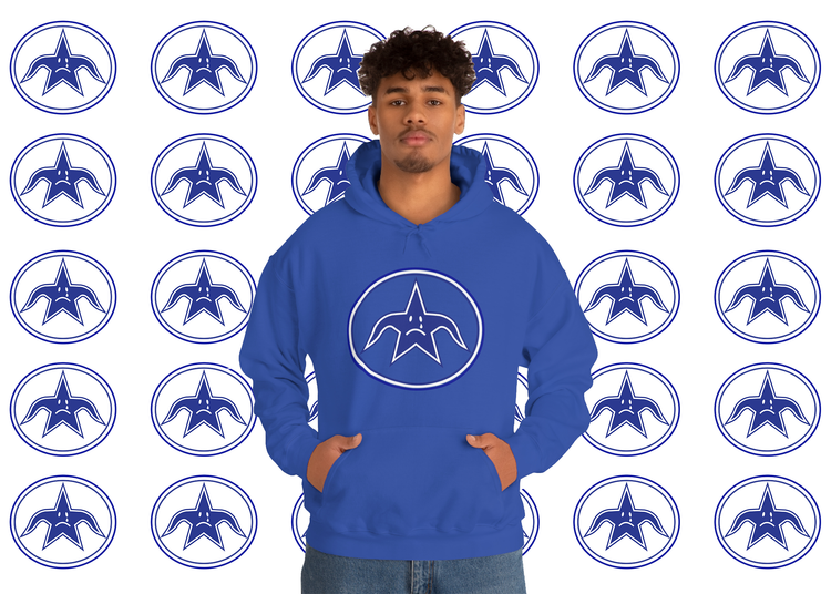 Man in a royal blue Sadboy hoodie in front of a wall of crying stars